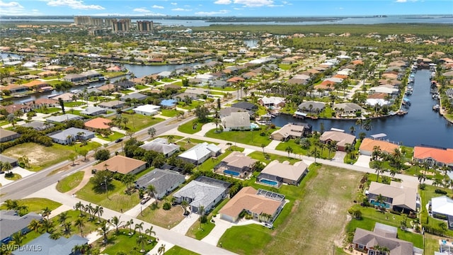 2110 SW 52nd Ter, Cape Coral, FL 33914 - aerial view of property and surrounding area featuring nearby suburban area and a large body of water
