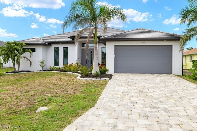 2110 SW 52nd Ter, Cape Coral, FL 33914 - view of front facade with decorative driveway, stucco siding, and a garage