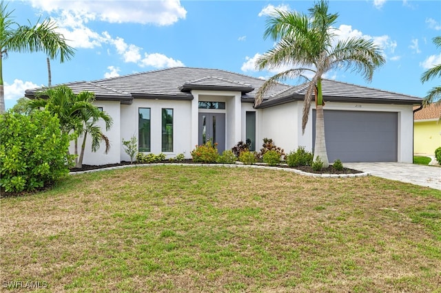 2110 SW 52nd Ter, Cape Coral, FL 33914 - view of front of property with stucco siding, a garage, driveway, and a front yard