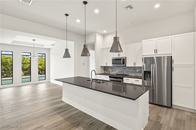 2110 SW 52nd Ter, Cape Coral, FL 33914 - kitchen featuring appliances with stainless steel finishes, a sink, dark countertops, white cabinets, and recessed lighting