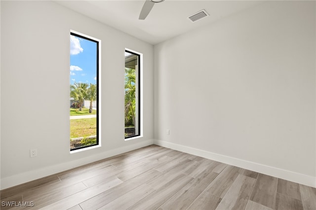 2110 SW 52nd Ter, Cape Coral, FL 33914 - empty room with light wood-style flooring, ceiling fan, and baseboards