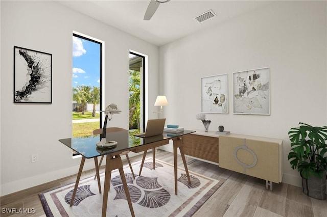 2110 SW 52nd Ter, Cape Coral, FL 33914 - office featuring light wood-type flooring, a ceiling fan, and baseboards