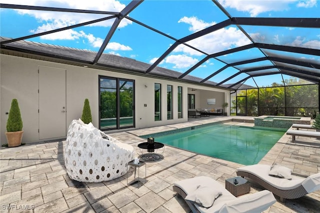 2110 SW 52nd Ter, Cape Coral, FL 33914 - view of swimming pool with a patio area, a pool with connected hot tub, and glass enclosure