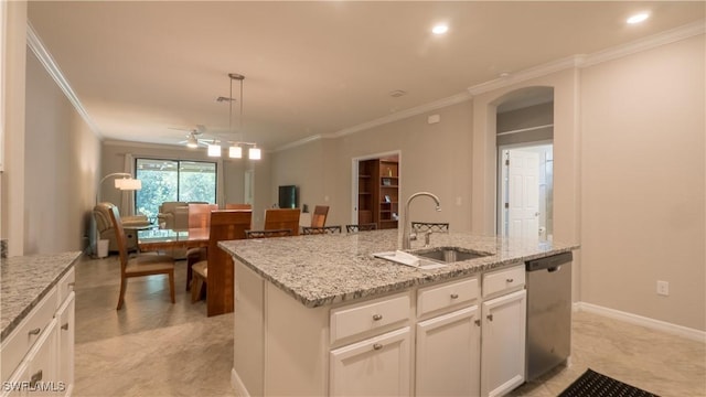 9076 Glenforest Dr, Naples, FL 34120 - kitchen featuring stainless steel dishwasher, a sink, ornamental molding, a ceiling fan, and arched walkways