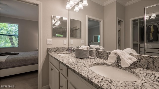 9076 Glenforest Dr, Naples, FL 34120 - bathroom with crown molding, ensuite bath, double vanity, and a walk in closet