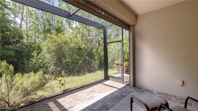 9076 Glenforest Dr, Naples, FL 34120 - unfurnished sunroom featuring plenty of natural light