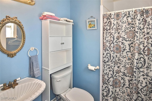 19006 Flamingo Rd, Fort Myers, FL 33967 - full bath with a sink, toilet, and curtained shower