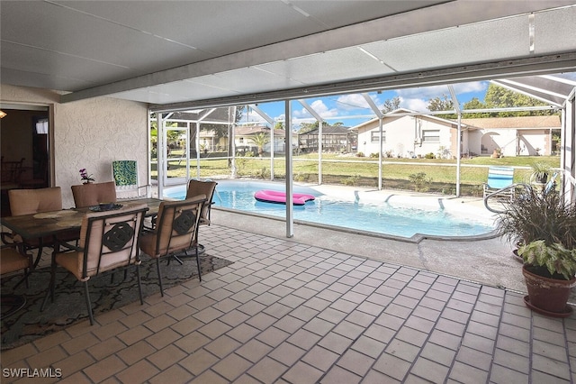 19006 Flamingo Rd, Fort Myers, FL 33967 - outdoor pool with glass enclosure, a patio area, and a residential view