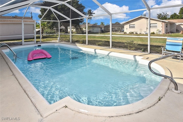 19006 Flamingo Rd, Fort Myers, FL 33967 - outdoor pool featuring a lanai, a patio area, and a lawn