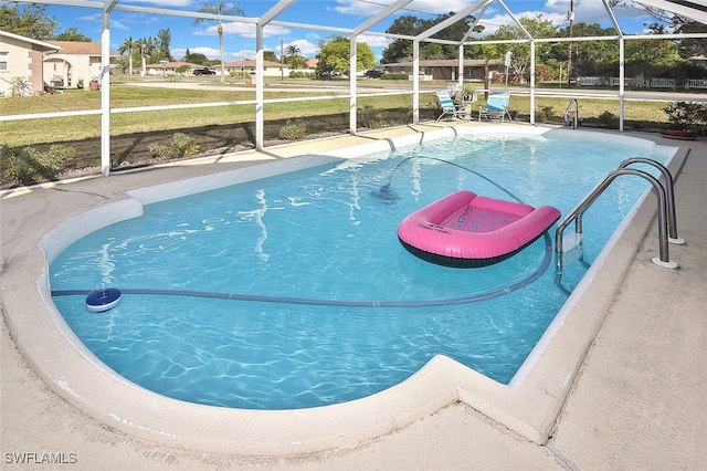 19006 Flamingo Rd, Fort Myers, FL 33967 - swimming pool featuring a lawn and a lanai