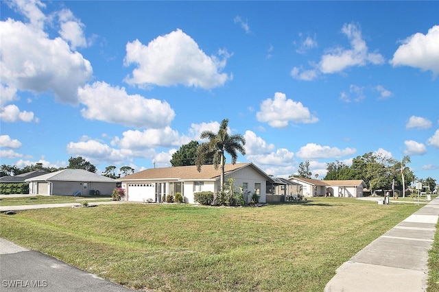 19006 Flamingo Rd, Fort Myers, FL 33967 - single story home featuring an attached garage, a front lawn, and a residential view