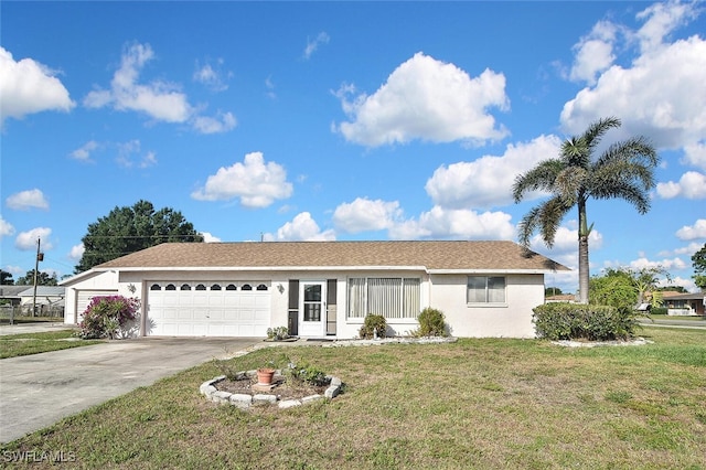 19006 Flamingo Rd, Fort Myers, FL 33967 - single story home featuring an attached garage, a front yard, stucco siding, and driveway