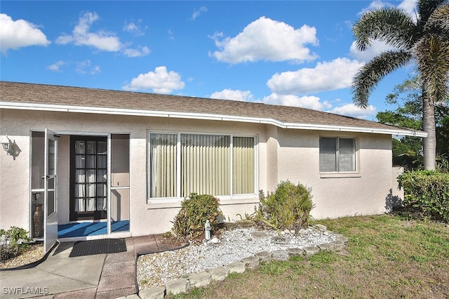 19006 Flamingo Rd, Fort Myers, FL 33967 - doorway to property featuring stucco siding