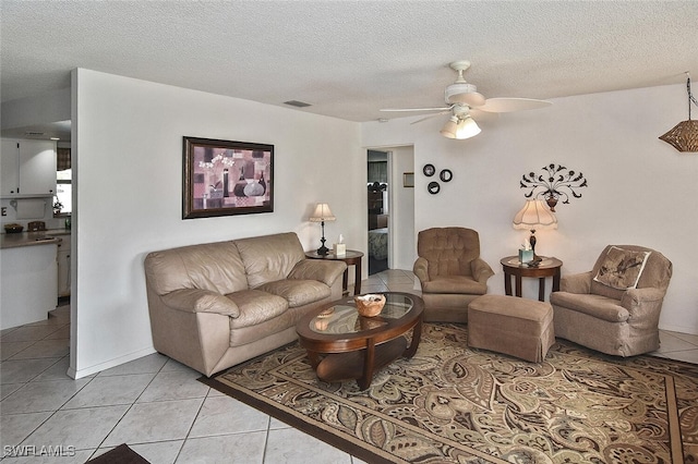 19006 Flamingo Rd, Fort Myers, FL 33967 - living room featuring ceiling fan, light tile patterned floors, and a textured ceiling