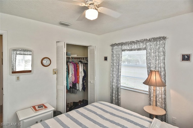 19006 Flamingo Rd, Fort Myers, FL 33967 - bedroom with a closet, a textured ceiling, and a ceiling fan