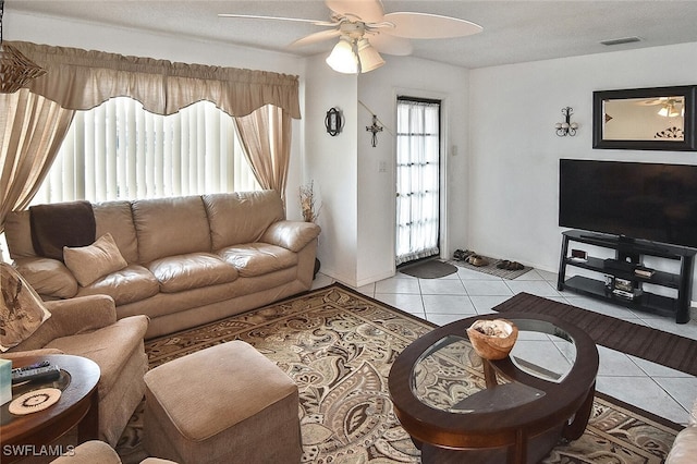 19006 Flamingo Rd, Fort Myers, FL 33967 - living area with a ceiling fan, light tile patterned floors, and baseboards