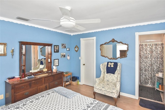 19006 Flamingo Rd, Fort Myers, FL 33967 - bedroom with wood finished floors, a ceiling fan, baseboards, and ensuite bath