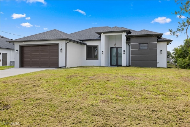 2513 13th St SW, Lehigh Acres, FL 33976 - view of front of house featuring french doors, stucco siding, a garage, and driveway