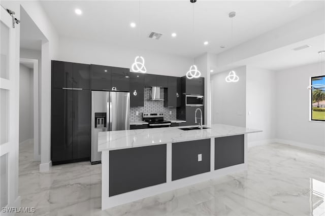 2513 13th St SW, Lehigh Acres, FL 33976 - kitchen featuring a sink, stainless steel appliances, modern cabinets, dark cabinets, and light marble finish flooring