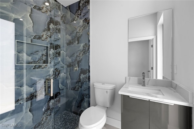 2513 13th St SW, Lehigh Acres, FL 33976 - bathroom featuring toilet, a marble finish shower, and vanity