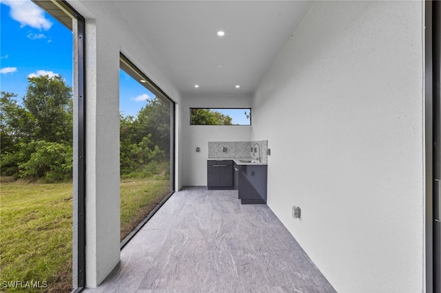 2513 13th St SW, Lehigh Acres, FL 33976 - unfurnished sunroom featuring a sink