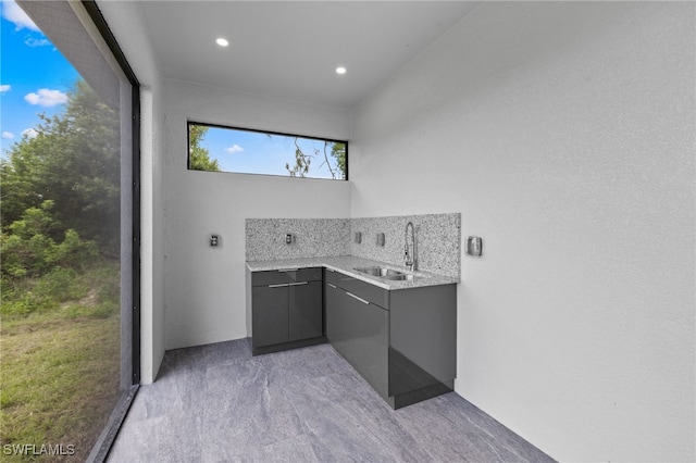 2513 13th St SW, Lehigh Acres, FL 33976 - bathroom with backsplash, recessed lighting, and vanity
