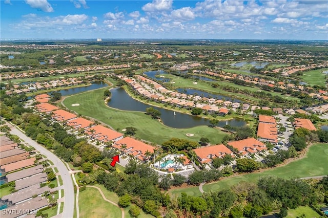 23560 Wisteria Pointe Dr Unit 506, Estero, FL 34135 - aerial overview of property's location with nearby suburban area, a large body of water, and a golf club