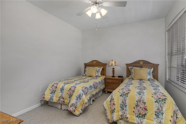 23560 Wisteria Pointe Dr Unit 506, Estero, FL 34135 - bedroom featuring carpet, a ceiling fan, and baseboards