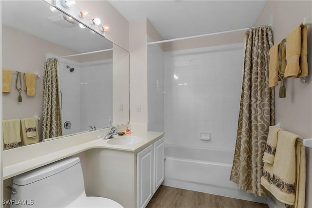 23560 Wisteria Pointe Dr Unit 506, Estero, FL 34135 - bathroom with toilet, shower / tub combo, vanity, and wood finished floors
