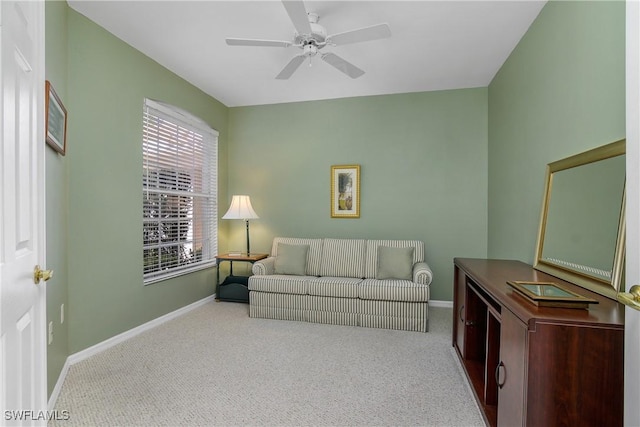 23560 Wisteria Pointe Dr Unit 506, Estero, FL 34135 - living room featuring carpet floors, baseboards, and a ceiling fan