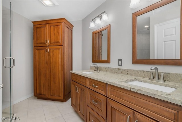 23560 Wisteria Pointe Dr Unit 506, Estero, FL 34135 - full bathroom with double vanity, tile patterned floors, a stall shower, and baseboards