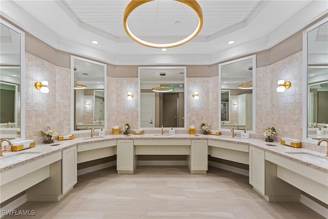 23560 Wisteria Pointe Dr Unit 506, Estero, FL 34135 - bathroom featuring a raised ceiling, vanity, and wood ceiling