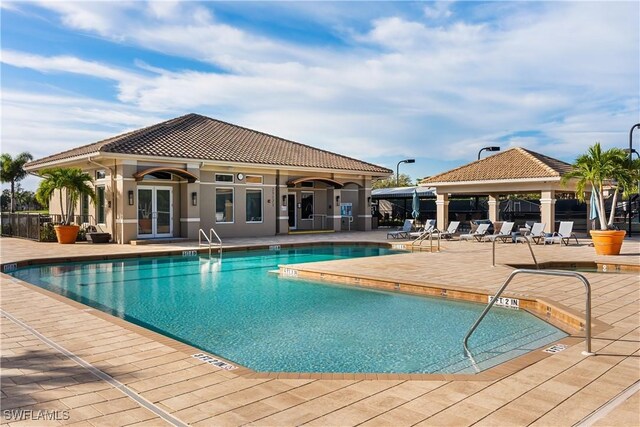 23560 Wisteria Pointe Dr Unit 506, Estero, FL 34135 - community pool featuring a gazebo and a patio