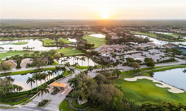 23560 Wisteria Pointe Dr Unit 506, Estero, FL 34135 - aerial view at dusk of a water view, view of golf course, and a residential view