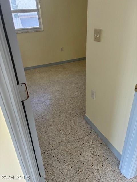 1610 Woodlawn Ave, Punta Gorda, FL 33950 - spare room featuring speckled floor and baseboards