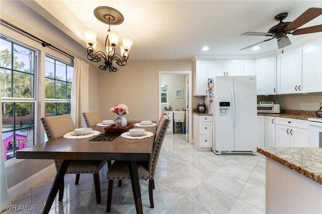 2313 Hines Ave, Alva, FL 33920 - dining space with recessed lighting, a ceiling fan, and a chandelier