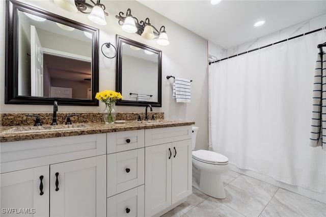 2313 Hines Ave, Alva, FL 33920 - full bath featuring double vanity, toilet, recessed lighting, and shower / bath combo