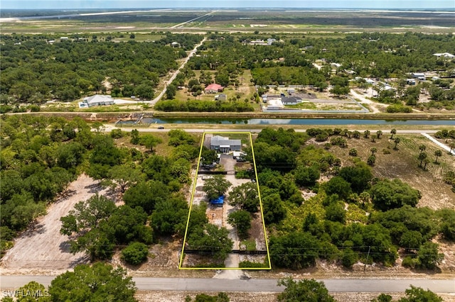 2313 Hines Ave, Alva, FL 33920 - aerial view of property and surrounding area featuring property parcel outlined and a large body of water