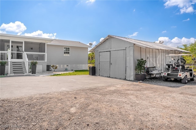 2313 Hines Ave, Alva, FL 33920 - view of shed with a sunroom, central AC, and stairs