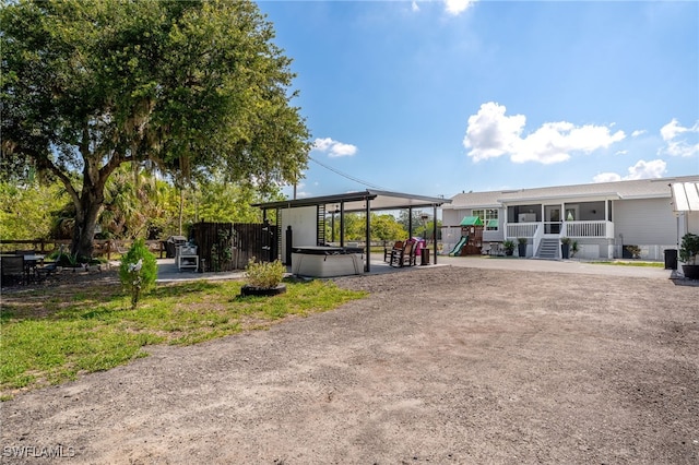 2313 Hines Ave, Alva, FL 33920 - rear view of house with a playground and a sunroom