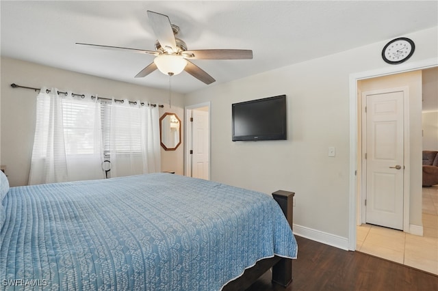 426 Chestnut Ave NW, Port Charlotte, FL 33952 - bedroom featuring baseboards, wood finished floors, and a ceiling fan