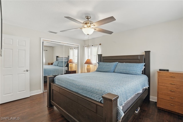 426 Chestnut Ave NW, Port Charlotte, FL 33952 - bedroom featuring baseboards, dark wood-type flooring, a closet, and a ceiling fan