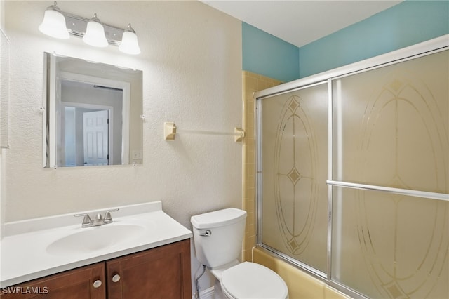 426 Chestnut Ave NW, Port Charlotte, FL 33952 - full bathroom featuring vanity, enclosed tub / shower combo, toilet, and a textured wall