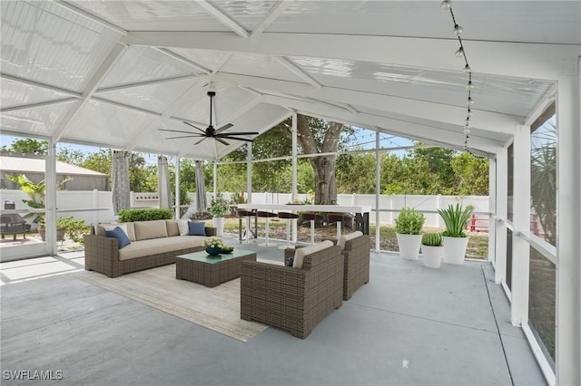 426 Chestnut Ave NW, Port Charlotte, FL 33952 - fenced backyard with outdoor dining area, a patio, an outdoor living space, and a ceiling fan