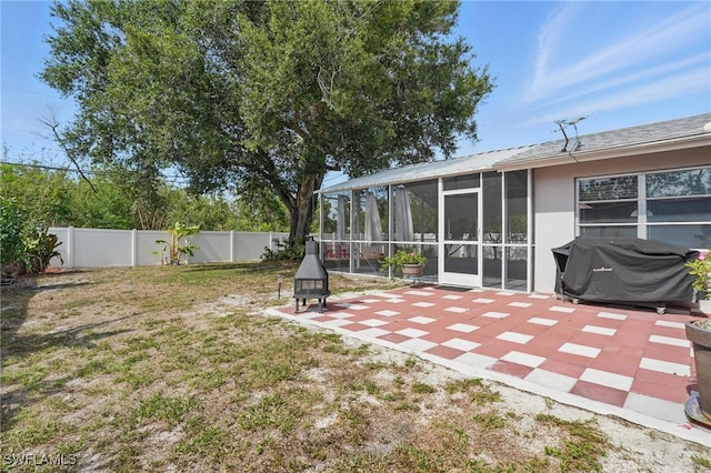 426 Chestnut Ave NW, Port Charlotte, FL 33952 - view of yard featuring a patio area and a sunroom
