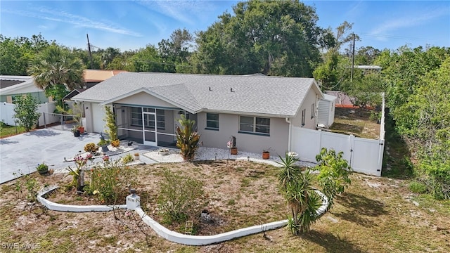 426 Chestnut Ave NW, Port Charlotte, FL 33952 - rear view of house featuring a gate, stucco siding, a shingled roof, and a sunroom