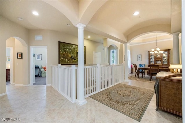 21726 Baccarat Ln Unit 201, Estero, FL 33928 - corridor featuring ornate columns, recessed lighting, a chandelier, vaulted ceiling, and light tile patterned floors