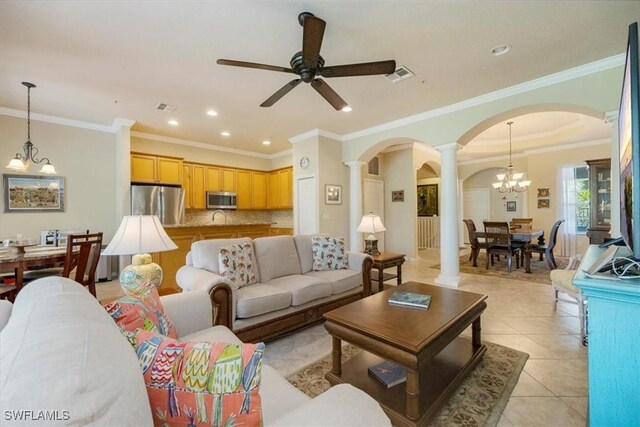 21726 Baccarat Ln Unit 201, Estero, FL 33928 - living room featuring ornate columns, arched walkways, a ceiling fan, light tile patterned floors, and a chandelier