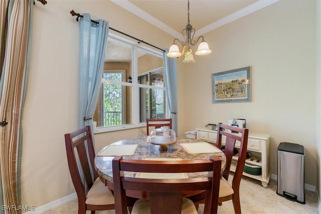 21726 Baccarat Ln Unit 201, Estero, FL 33928 - dining area featuring a chandelier, crown molding, and baseboards