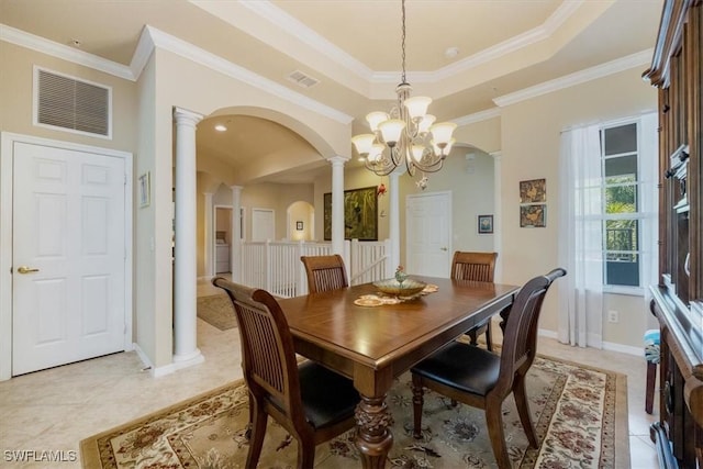 21726 Baccarat Ln Unit 201, Estero, FL 33928 - dining room featuring decorative columns, arched walkways, a raised ceiling, a chandelier, and ornamental molding